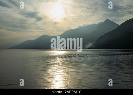 Scenic view of the Lake Maggiore at sunset on ferry boat cruising from Cannobio to Cannero Riviera, Piedmont, Italy Stock Photo
