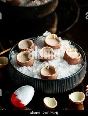 kinder surprise with cocoa in a bowl with ice Stock Photo