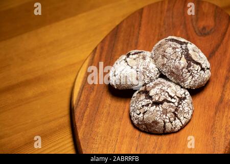Cracked Chocolate Cookies On A Wooden Surface Stock Photo