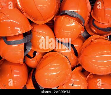 a heap of construction helmets Stock Photo