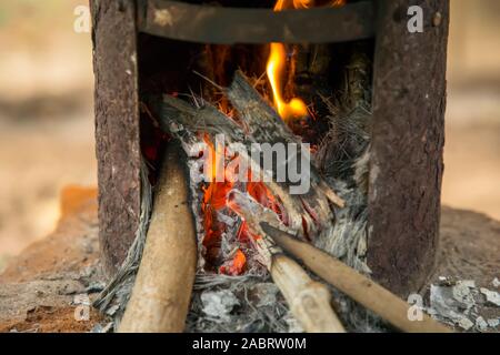 Villagers cooking in the morning using firewood Stock Photo