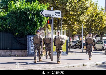 Armed Eurocorps soldiers on anti-terrorist patrol, Place Broglie, Strasbourg, Alsace, Grand Est, France Stock Photo