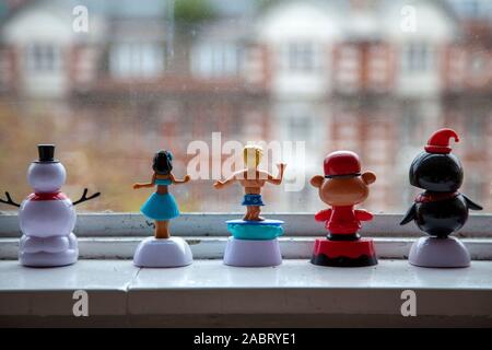 Figures on a window sill Stock Photo - Alamy