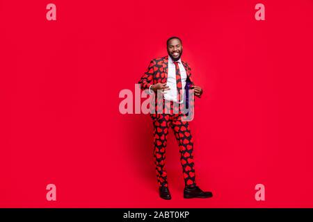 Full body photo of funky dark skin man playing amour cupid role making romance surprise for girlfriend wear hearts pattern stylish suit costume shirt Stock Photo
