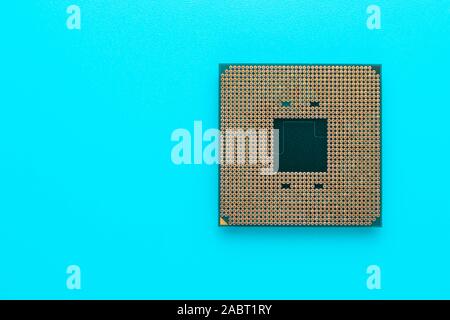 Microchip of computer on a turquoise background. Processor, cpu. Technology concept. Microprocessor of pc. Stock Photo