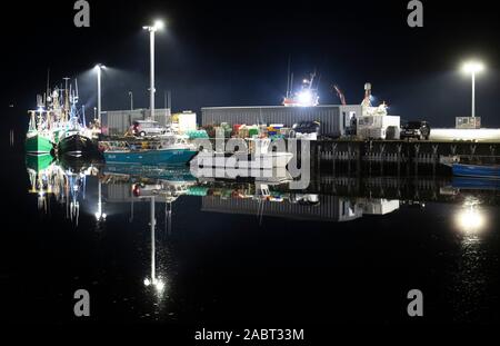 Ullapool harbour at night reflected in the still waters of Loch Broom, Ullapool, Wester Ross. PA Photo. Picture date: Thursday November 28, 2019. Photo credit should read: Jane Barlow/PA Wire Stock Photo