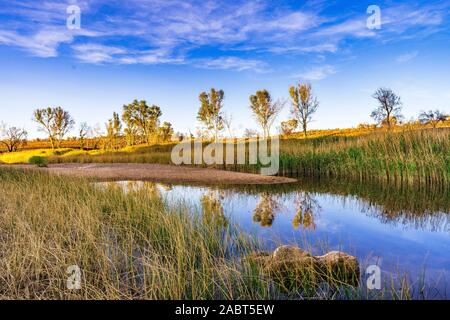 An stunning landscape reflected in the creek at Glen Helen Gorge in central Australia Stock Photo