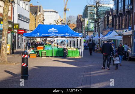 Fruit and vegetable stall in Staines-Upon-Thames Market in High Street, Staines, a town in Spelthorne, Surrey, south-east England, UK Stock Photo