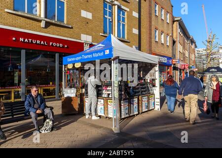 Watch repair and hardware stall in Staines-Upon-Thames Market in High Street, Staines, a town in Spelthorne, Surrey, south-east England, UK Stock Photo