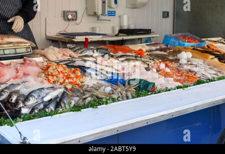 Fishmonger's van stall with a display of fresh fish in Staines-Upon-Thames Market, High Street, Staines, a town in Spelthorne, Surrey, SE England, UK Stock Photo