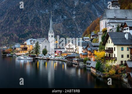 Hallsttt, Switzerland - November 2, 2019: Scenery of famous old village, world heritage Hallstatt, Austria. Hallstatt lake reflect town as mirror on w Stock Photo
