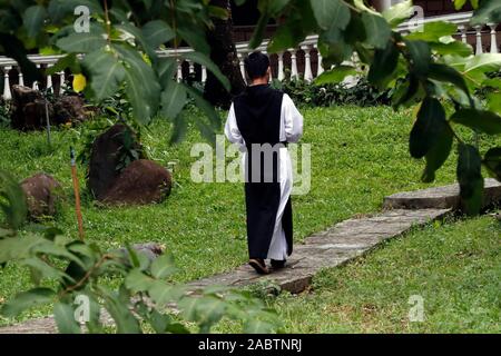 Cistercian Abbey.  Our Lady of My Ca.  Monk in the garden.  Vietnam. Stock Photo