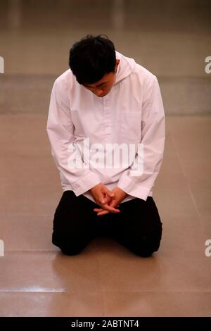 Cistercian Abbey.  Our Lady of My Ca. Monk praying in the church.  Vietnam. Stock Photo