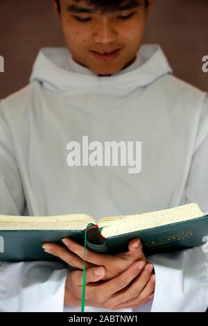 Cistercian Abbey.  Our Lady of My Ca. Monk reading the bible. Vietnam. Stock Photo