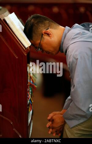 Cistercian Abbey.  Our Lady of My Ca. Monk praying in the church. Vietnam. Stock Photo