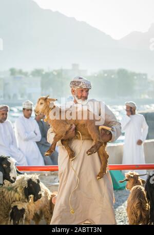 Nizwa, Oman, December 2015: omani man  at the old Nizwa goat market Stock Photo