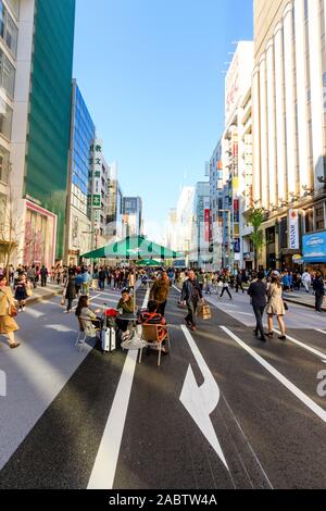 Ginza, Tokyo's fashionable district. People walking along Chuo Dori on ...