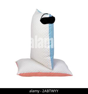 Personofied quilted pillows with sleeping mask isolated on white background. Soft cushion for comfortable sleep and sweet dreaming Stock Photo