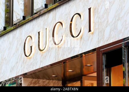 Close up of the Gucci logo over entrance of Gucci flagship store on the Tokyo Ginza fashionable shopping street Stock Photo