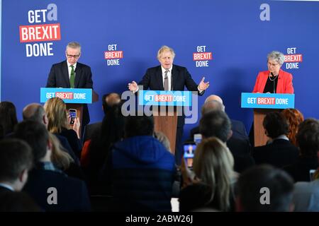Prime Minister Boris Johnson and Chancellor of the Duchy of Lancaster Michael Gove (left) are joined by former Labour MP, Gisela Stuart (right), speaking at a press conference in Millbank Tower, London, while on the General Election campaign trail. Stock Photo