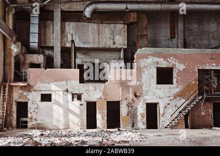 Inside wall an old abandoned industrial building, factory. Stock Photo