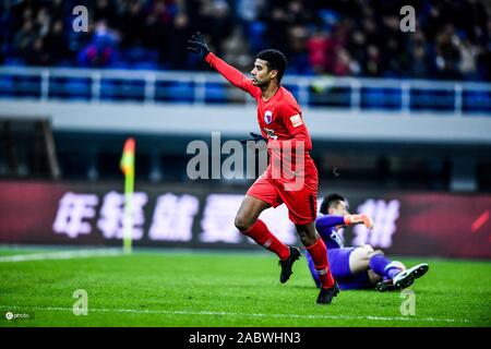 Brazilian football player Alan Douglas Borges de Carvalho, simply known as Alan, of Tianjin Tianhai F.C. celebrates after scoring during the 29th round match of Chinese Football Association Super League (CSL) against Dalian Yifang in Tianjin, China, 27 November 2019. Tianjin Tianhai slashed Dalian Yifang with 5-1. Stock Photo