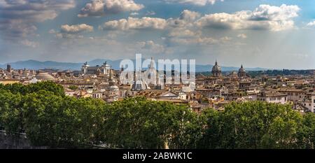 Beautiful panorama of Rome. Cityscape. View on the city of Rome from the Castle Sant'Angelo. Beautiful sunny weather with white clouds in Rome. Stock Photo