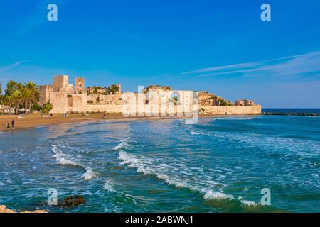 Historical, Ancient Kizkalesi, Kiz Kalesi or Maiden's Castle with Korykos Ruins in Mersin Beach from Turkey near Mediterranean Sea. Stock Photo