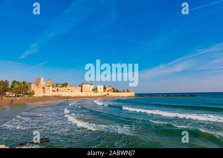 Historical, Ancient Kizkalesi, Kiz Kalesi or Maiden's Castle with Korykos Ruins in Mersin Beach from Turkey near Mediterranean Sea. Stock Photo