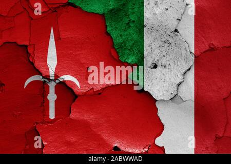 flags of Trieste and Italy painted on cracked wall Stock Photo