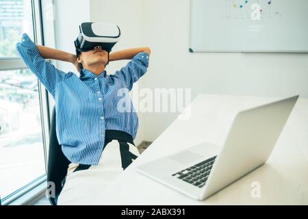 Modern business woman using vr glasses Stock Photo