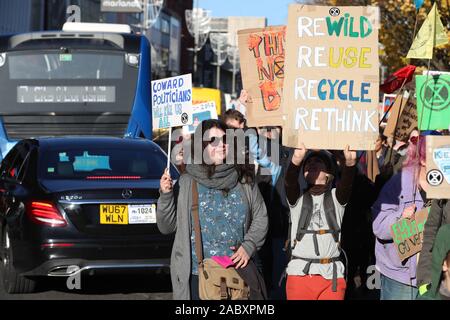 Southampton, UK. 29th November 2019. Extinction Rebellion campaigners march through Southampton's shopping precinct on Black Friday as part of the Global Climate Change Strike. Credit Stuart Martin/Alamy Live News Stock Photo