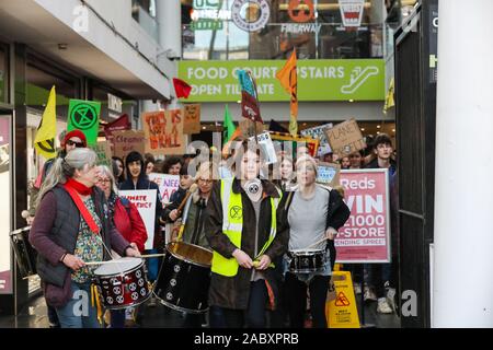 Southampton, UK. 29th November 2019. Extinction Rebellion campaigners march through Southampton's shopping precinct on Black Friday as part of the Global Climate Change Strike. Credit Stuart Martin/Alamy Live News Stock Photo