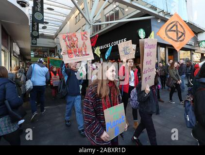 Southampton, UK. 29th November 2019. Extinction Rebellion campaigners march through Southampton's shopping precinct on Black Friday as part of the Global Climate Change Strike. Credit Stuart Martin/Alamy Live News Stock Photo