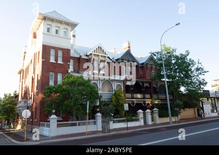 Row of 4 terrace houses red brick buildings in Federation architecture style on Beaufort St Northbridge Perth Western Australia. Stock Photo