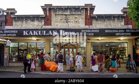 Hare Krishnas supporters dancing and singing in front of Kakulus Bris grocery store on William Street Northbridge Perth Western Australia. Stock Photo