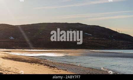 sunset over sandvika beach in Tromso region during a spring afternoon, Norway Stock Photo