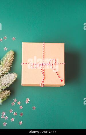 Five different sizes Christmas gift box, pine branch and stars on the green background. Top view. Stock Photo
