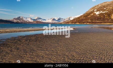 sunset over sandvika beach in Tromso region during a spring afternoon, Norway Stock Photo