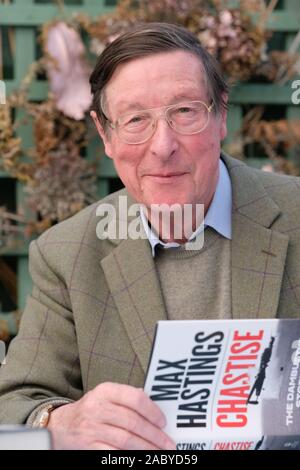 Hay Festival Winter Weekend, Hay on Wye, Powys, Wales, UK - Friday 29th November 2019 - Author and journalist Max Hastings signs copies of his latest book Chastise - The Dambusters Story 1943. Credit: Steven May/Alamy Live News Stock Photo