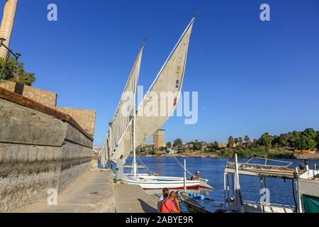 Wooden sailing boats called Feluccas on the banks of the River Nile in Aswan, Egypt, Africa Stock Photo