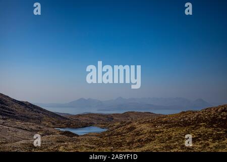 View across to the Isles of Raasay and Skye from the top of 'the Pass of Cattle' or 'Bealach na Ba' on the Applecross peninsula. Stock Photo