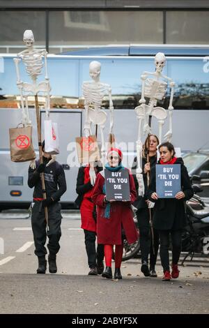 Westminster, London, UK. 29th Nov, 2019. Outside the Conservative Party HQ, protesters support XR campaigners on hunger strike with banners and several skeletons. Protesters from XR Extinction Rebellion once again start their campaign of awareness and action on climate change in Westminster, joining their regular hunger strike protesters at political party Headquarters in Westminster. Credit: Imageplotter/Alamy Live News Stock Photo