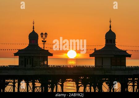 Blackpool Lancashire; UK Weather. 29th November 2019. After a freezing cold day over the north west of England, a striking winter sunset casts its warming rays over the towers on Blackpool's famous North Pier.   Credit: Cernan Elias/Alamy Live News Stock Photo