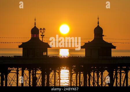Blackpool Lancashire; UK Weather. 29th November 2019. After a freezing cold day over the north west of England, a striking winter sunset casts its warming rays over the towers on Blackpool's famous North Pier.   Credit: Cernan Elias/Alamy Live News Stock Photo