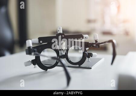 Special ophthalmologist device on the table in beautiful white room Stock Photo