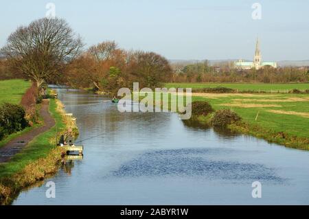 Chichester Ship Canal and Cathedral of the Holy Trinity, Chichester, from Hunston Bridge, West Sussex. December. Stock Photo