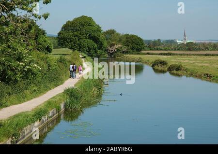 Chichester Ship Canal from Hunston Bridge, looking towards Chichester and the Cathedral Of The Holy Trinity. May.  West Sussex. Stock Photo