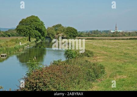 Chichester Ship Canal from Hunston Brdge, looking towards Chichester and the Cathedral Of The Holy Trinity. May. West Sussex Stock Photo