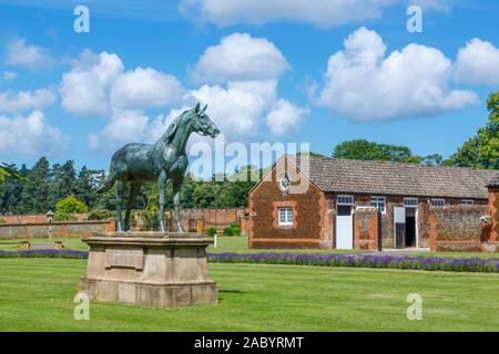 Statue of the Prince of Wales' racehorse Persimmon at The Queen's stables, The Royal Stud at Home Farm on the Sandringham Estate, Norfolk, UK Stock Photo